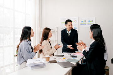 Modern youth are gathering, working as a team, and holding team meetings to achieve their goals.