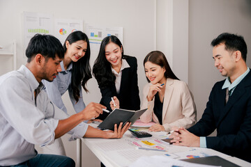 Brainstorming of young modern group. Team meeting to achieve goal. Business people discussing finance business and analysis. Teamwork concept in modern office. Calculating personal tax for client.