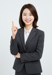 beautiful young woman wearing office clothes with expression has found an idea with hand pointing up happy face