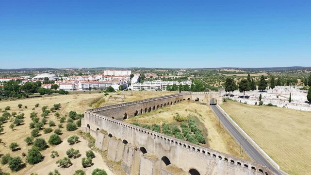 The Elvas aqueduct between city and arid countryside, in Europe, in Portugal, in Alentejo, Portalegre, in summer, on a sunny day.&nbsp;