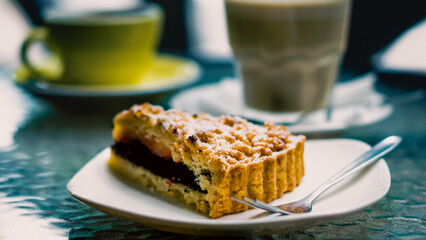 triangular piece of poppy pie and a fork with powdered sugar