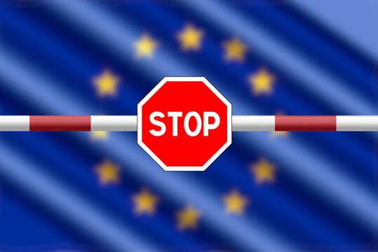 Flag of the European Union EU, barrier and stop sign