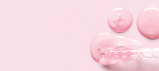 pipette drop of serum test on a light pink background
