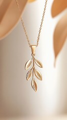 Gold pendant designed as a delicate branch with diamond accents on a light background