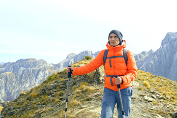 Portrait of a solo hiker taken against the backdrop of scenic mountains in Prokletije National...