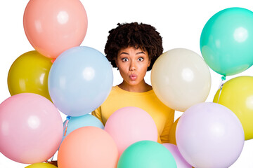Close-up portrait of her she nice attractive lovely lovable girlish funky funny cheerful wavy-haired girl sending kiss among air balls isolated over violet purple lilac pastel color background
