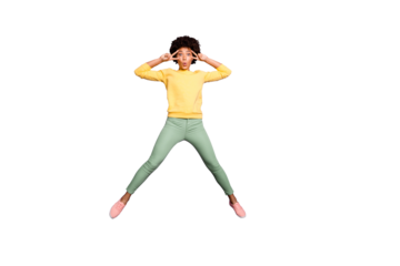 Full size photo of funky funny brunette curly hair mulatto girl jump  make v-signs near her face wear casual style clothing sneakers isolated violet color background