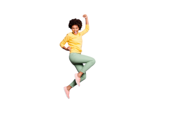 Full body photo of delighted afro american girl celebrate autumn spring jackpot victory raise fists scream yeah wear yellow sweater green pants trousers isolated over violet purple color background