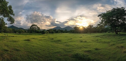 A beautiful green landscape of a mountain range with trees and sky at sunset in the southern region of Thailand. A Sri Lankan nature view with a beautiful cloudscape. 