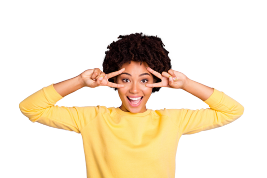 Photo of trendy curly cheerful positive girlfriend wearing yellow sweater showing you double v-sign expressing positive emotions on face isolated over pastel violet color background