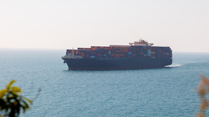 container ship carrying goods for international import export, business and industry regarding...