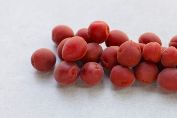 Umeboshi, Japanese pickled plums, Sour and salty taste.