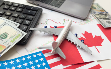 flags of the USA and Canada, dollars, charts