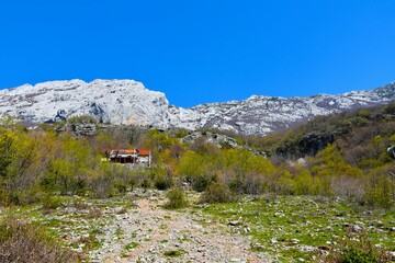 Mountain lodge in forest bellow the peaks in spring in Paklenica national park, Croatia