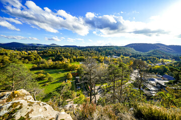 View of the surrounding landscape from the Pfaffenfelsen near Dahn. Nature with hills and forests in the Palatinate region. Lookout rock with panoramic views.
