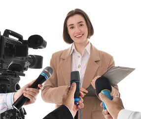 Journalists with microphones and video camera interviewing woman on white background, closeup