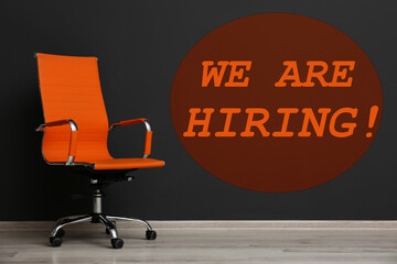 We are hiring. Empty office chair in room. Recruitment concept