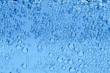 Soda water with bubbles as background, closeup