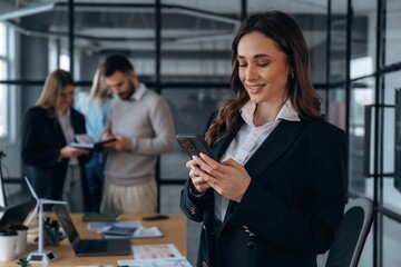 Phone call, standing. Business people are working in the office
