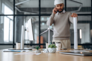 Fototapeta premium Walking and talking by phone. Businessman is working in the office