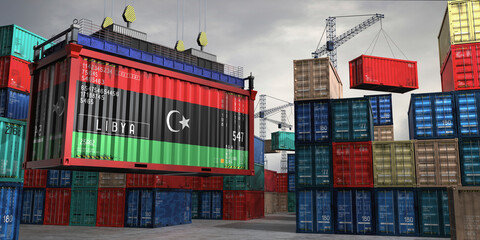Fototapeta premium Cargo container with flag of Libya lifted by crane at freight terminal - 3D illustration