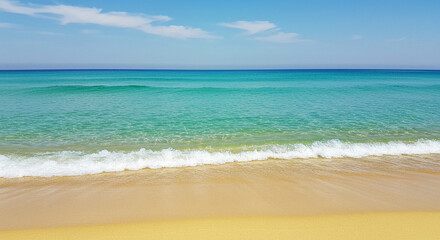 Fototapeta premium Waves Gently Washing Ashore on Sunny Beach Day