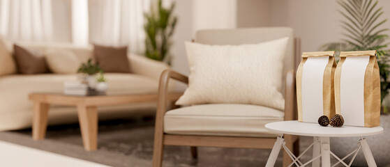 An armchair and round stool table with coffee bean bags and acorn in the living room. Cosy Interior.