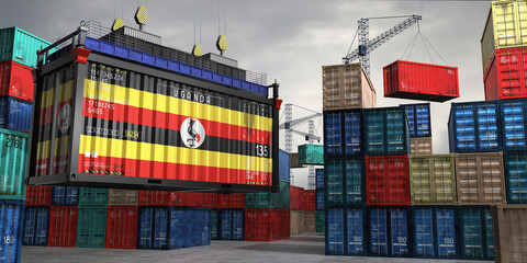 Fototapeta premium Cargo container with flag of Uganda lifted by crane at freight terminal - 3D illustration