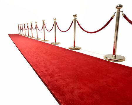 Red carpet with velvet ropes marking a prestigious event pathway