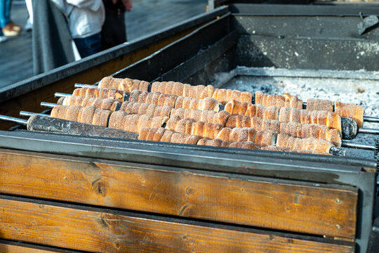 Prague, Czech Republic - 04.21.2025 - Spring time in Prague, tredelnik pastry on fire