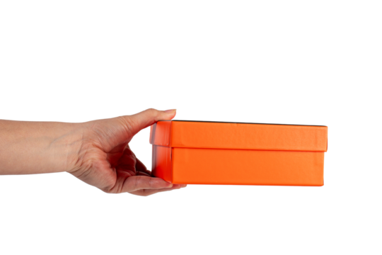 Orange box in hand isolated on transparent background 