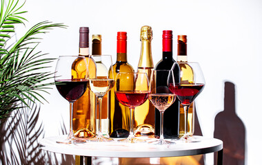 Non-alcoholic, alcohol free wine set. Red, white, rose wines in glasses with bottles. White...