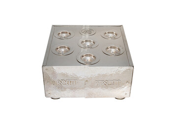 Elegant ornate silver seder plate with intricate engravings and decorative details, isolated on white background, used for ceremonial and religious purposes.