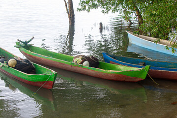 East Sumba &ndash; 04. 20. 2025 &ndash; Colorfully painted boats equipped with fishing gear are parked at the mouth of the river near the Kawangu fishing village