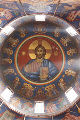 Obraz premium Ornate Church Dome with Religious Frescoes and Central Jesus Image
