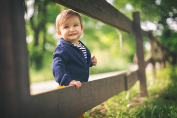 Portraits of happy family outdoors with their baby boy. Shallow DOF. Developed from RAW; retouched...