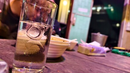 Refreshing Drink in Clear Glass on Wooden Table
