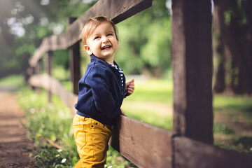 Portraits of happy family outdoors with their baby boy. Shallow DOF. Developed from RAW; retouched...