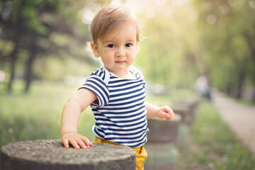 Portraits of happy family outdoors with their baby boy. Shallow DOF. Developed from RAW; retouched...