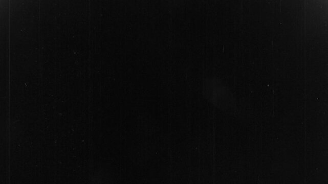16mm film black leader with dust, dirt and scratches, starting with transition from bright white light leaks / film burn. Genuine analog film scan. Grindhouse texture transition overlay.