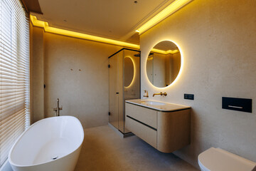 A bathroom contains a bathtub, sink, toilet, and a mirror for convenience