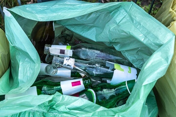 garbage, empty glass bottles in a garbage bag