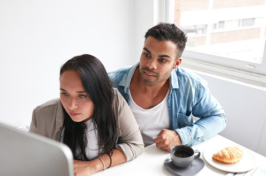 Couple shopping online from home