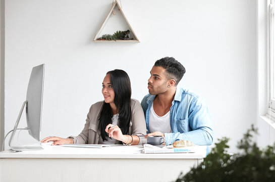 Young couple shopping online in their apartment