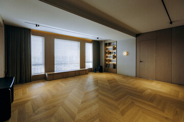 This elegant, modern living space is filled with natural light, showcasing stylish design