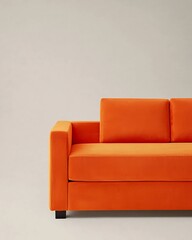 Large orange couch with two pillows on it