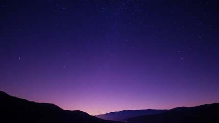 Fototapeta premium Serene Night Sky Above Majestic Purple Mountains Starry Twilight Landscape Peaceful Nature Scene Tranquil Evening Atmosphere Dark Blue Nighttime Starlit Celestial View Stunning Starry Sky Background 