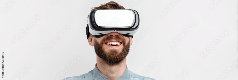 Fototapete happy man enjoying virtual reality experience with white vr goggles on flat background in relaxed se