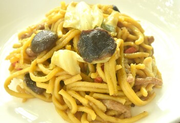 fried yakisoba Japanese noodles and cabbage with mushroom on plate