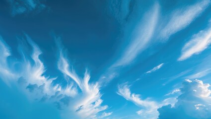 Bright blue sky with fluffy clouds in an outdoor scene